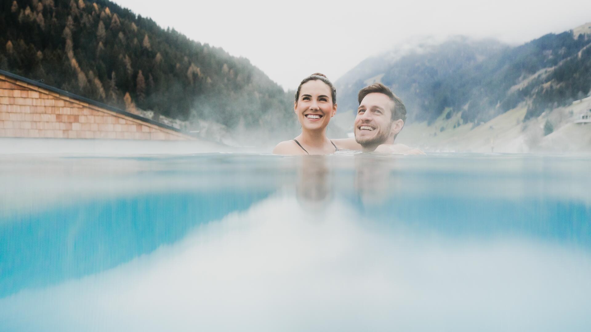 couple in infinity pool in Tyrol